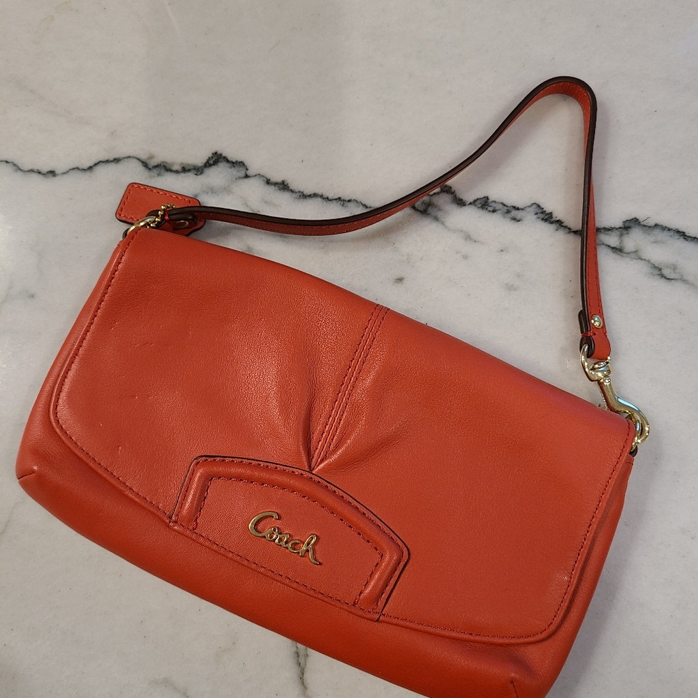 Small coral Coach purse.